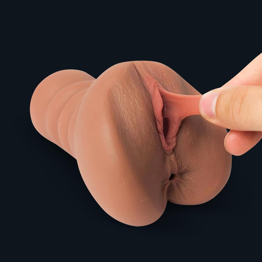 Fingers stretching the soft labia of Emma's vaginal opening